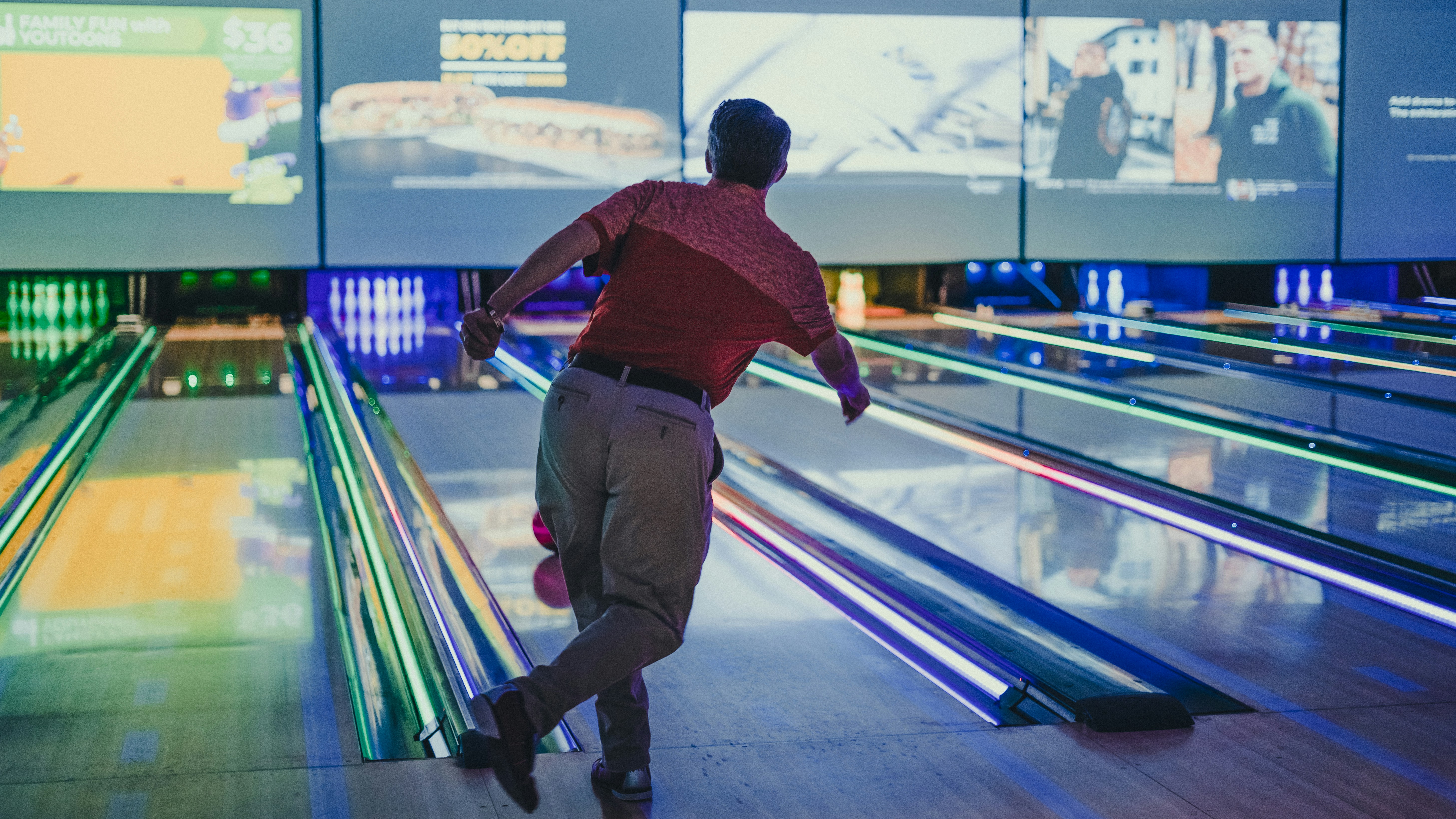 Modern bowling alley with digital displays