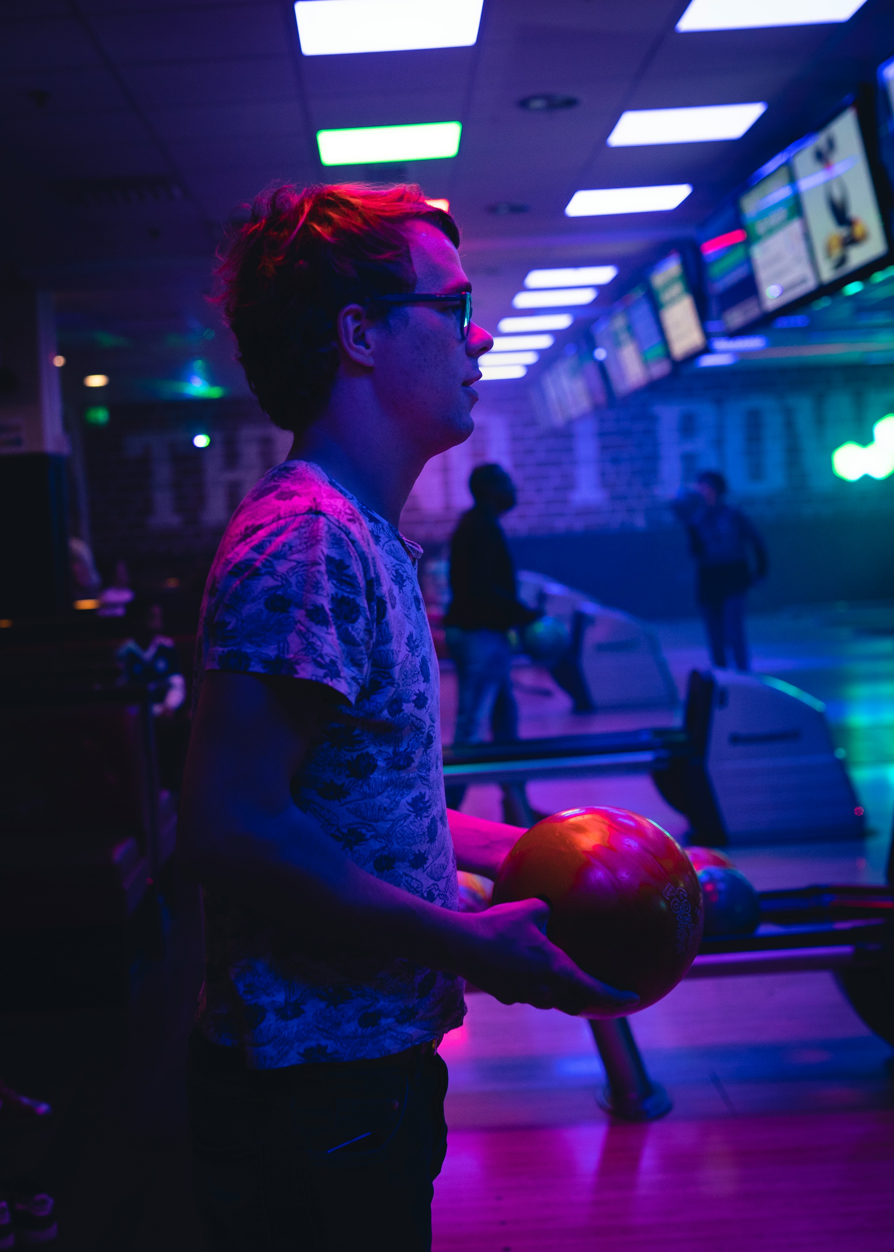 Bowler lit by cosmic neon lights
